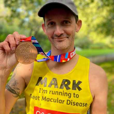 Mark London Marathon with medal 