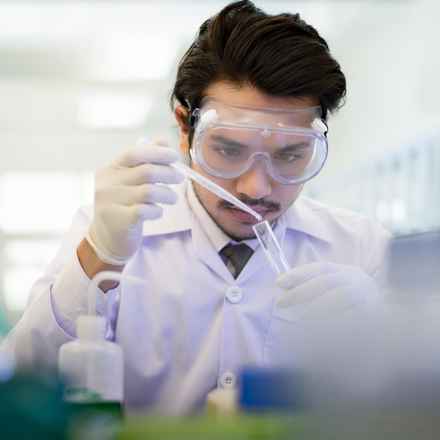 Scientist in laboratory with test tube