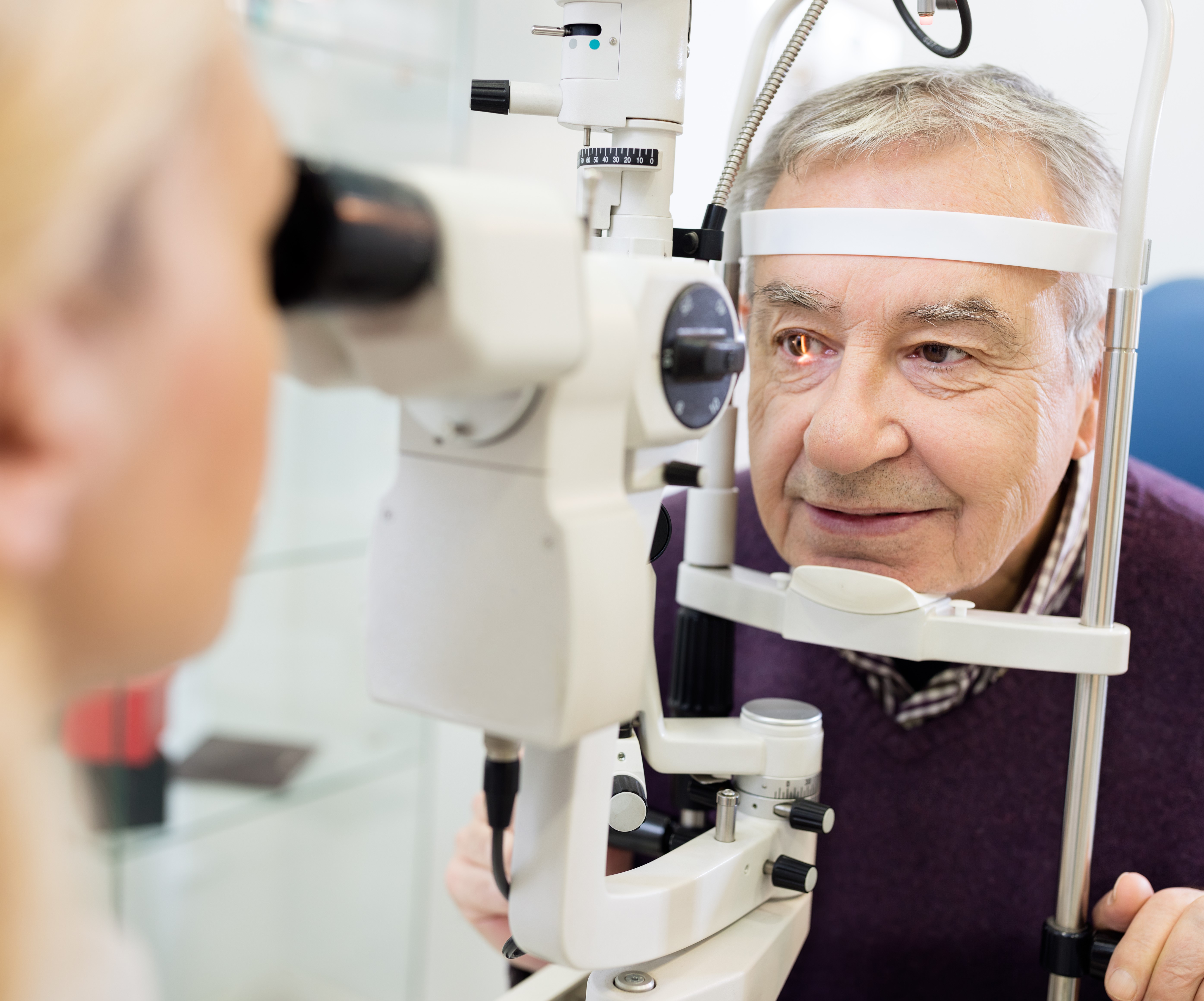 Image of an elderly man getting an eye scan