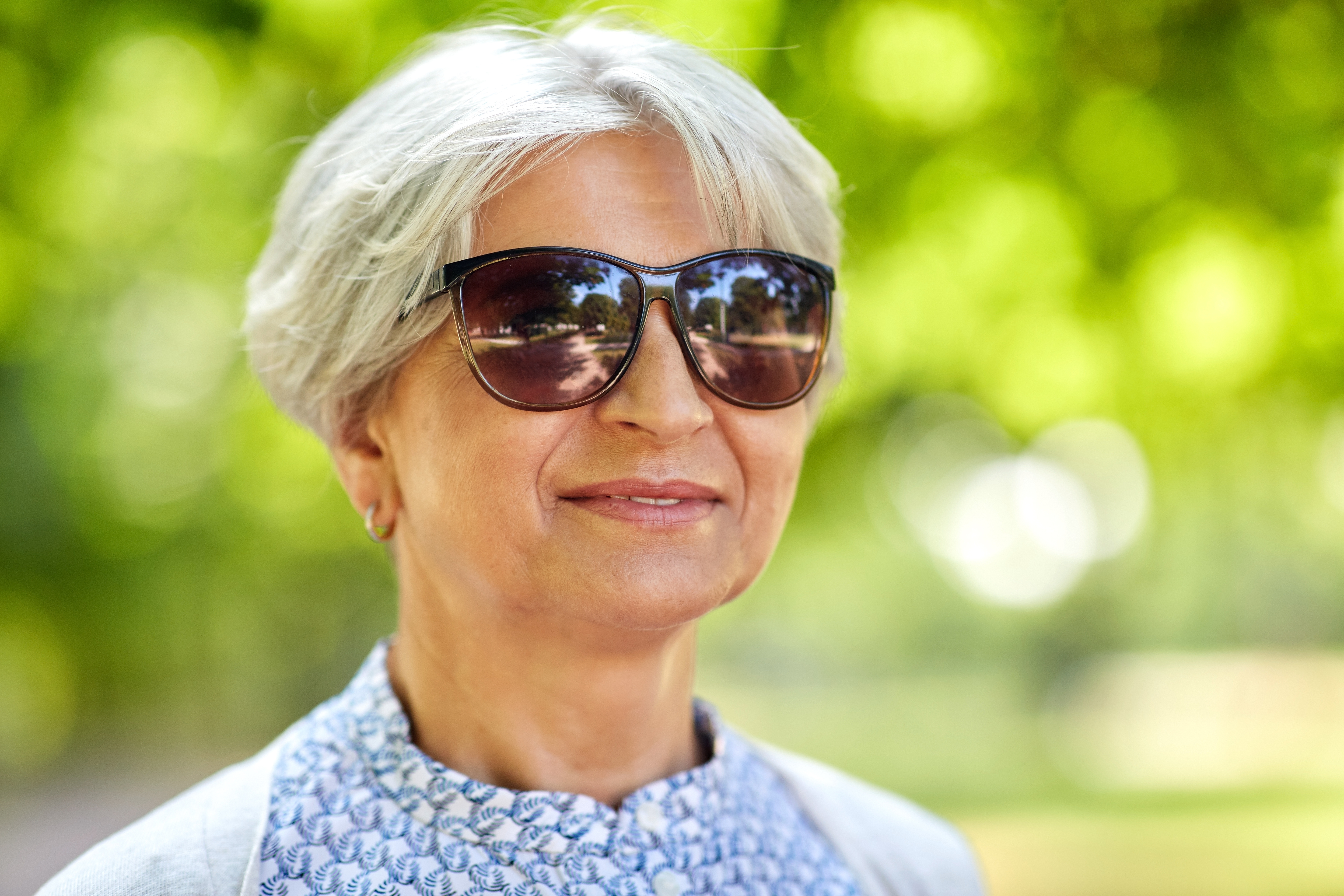 Lady outside wearing sunglasses