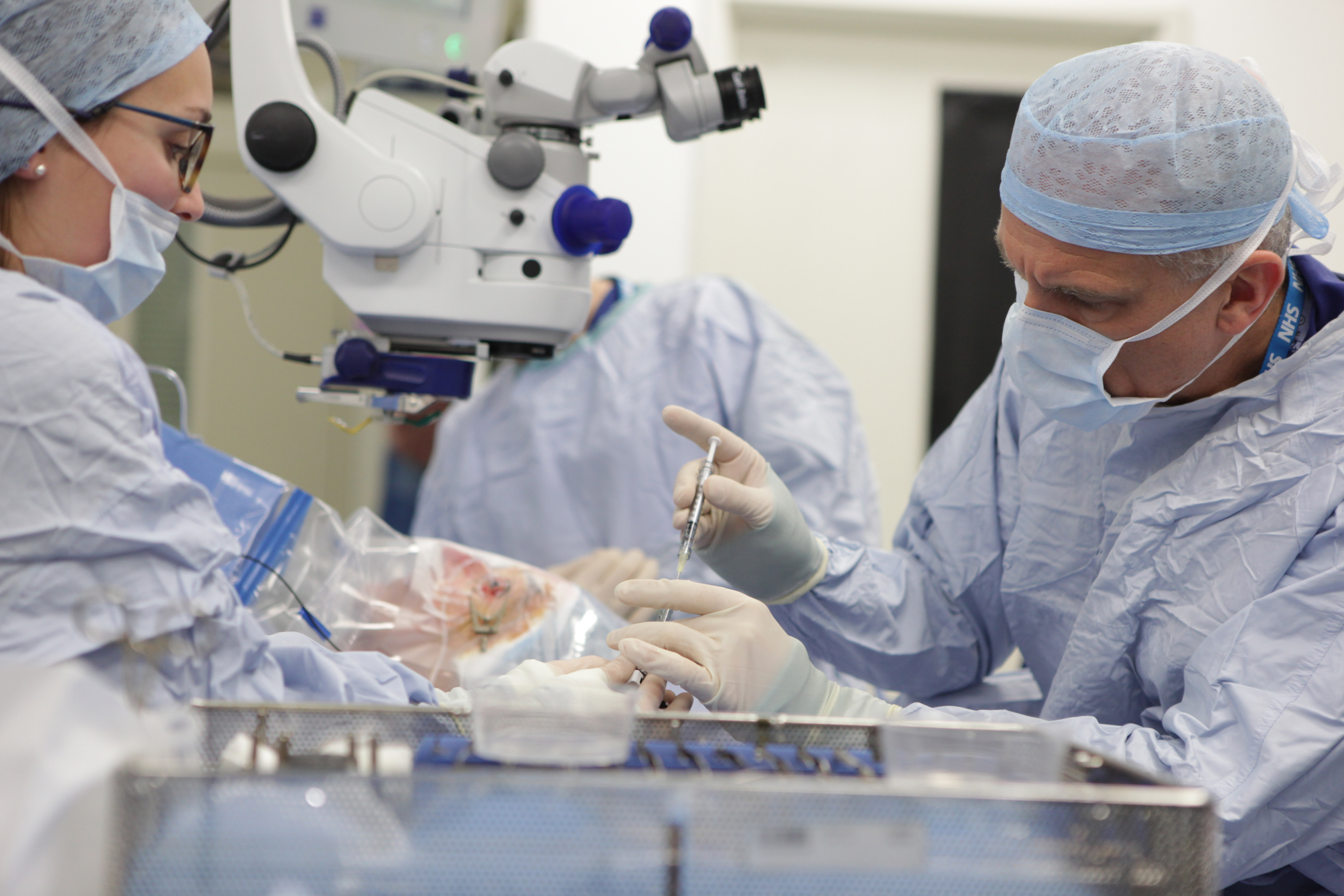 Prof MacLaren loads the virus into the injection syringe.