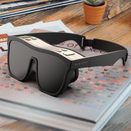 black glasses, wearable low vision aid. There are buttons on top of the black glasses to help control the tech. 