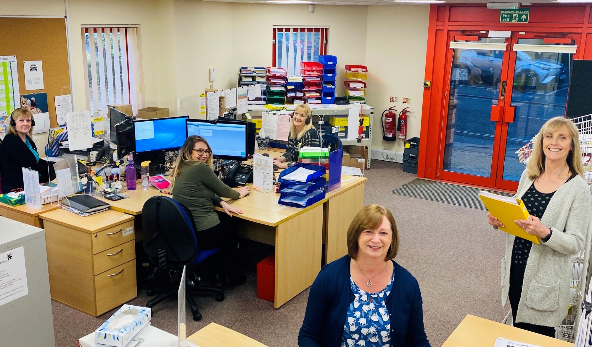 supporter care group photo in office