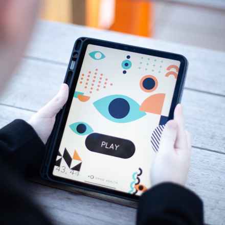 Okko Health App, person on tablet