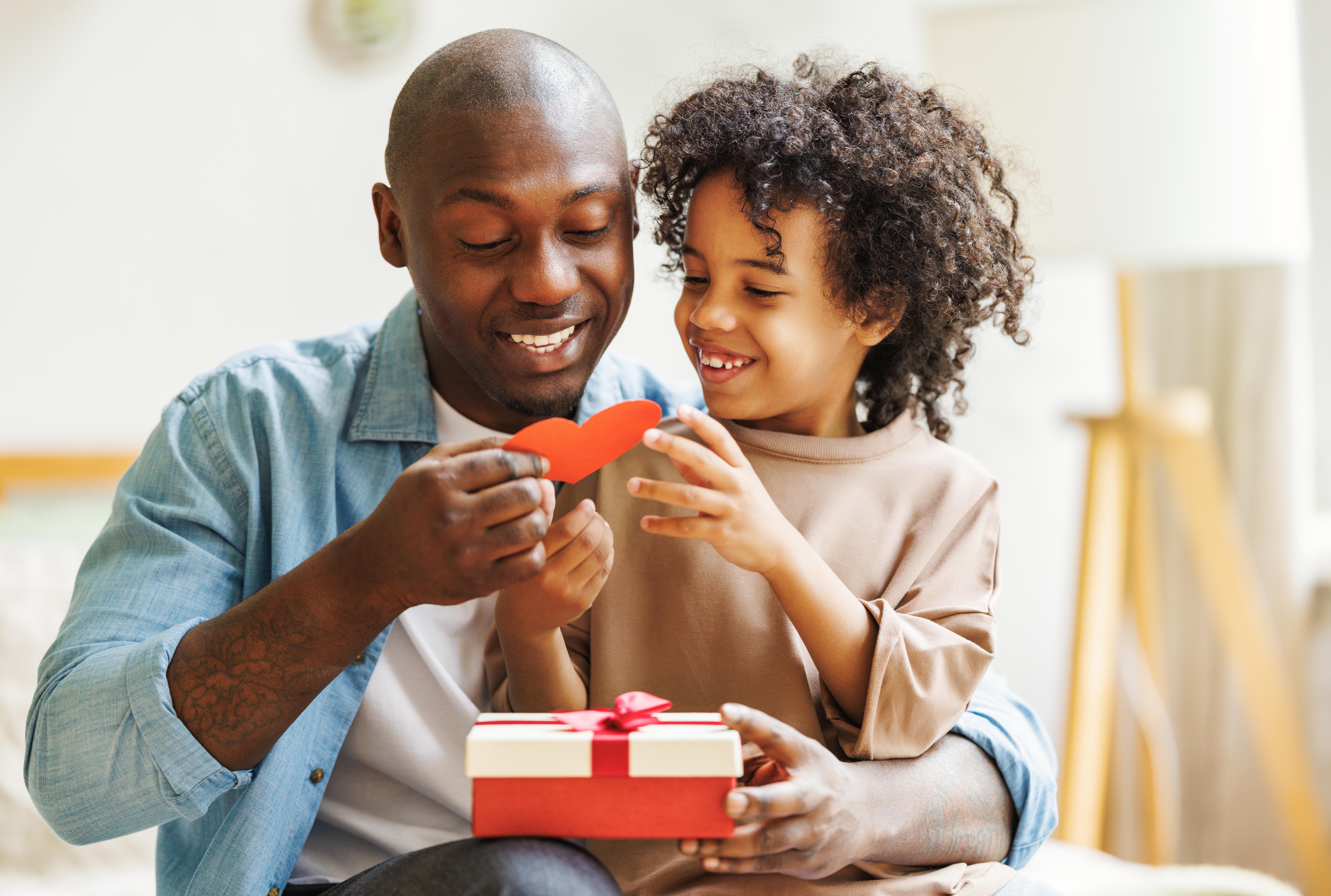 Father giving his son a heart