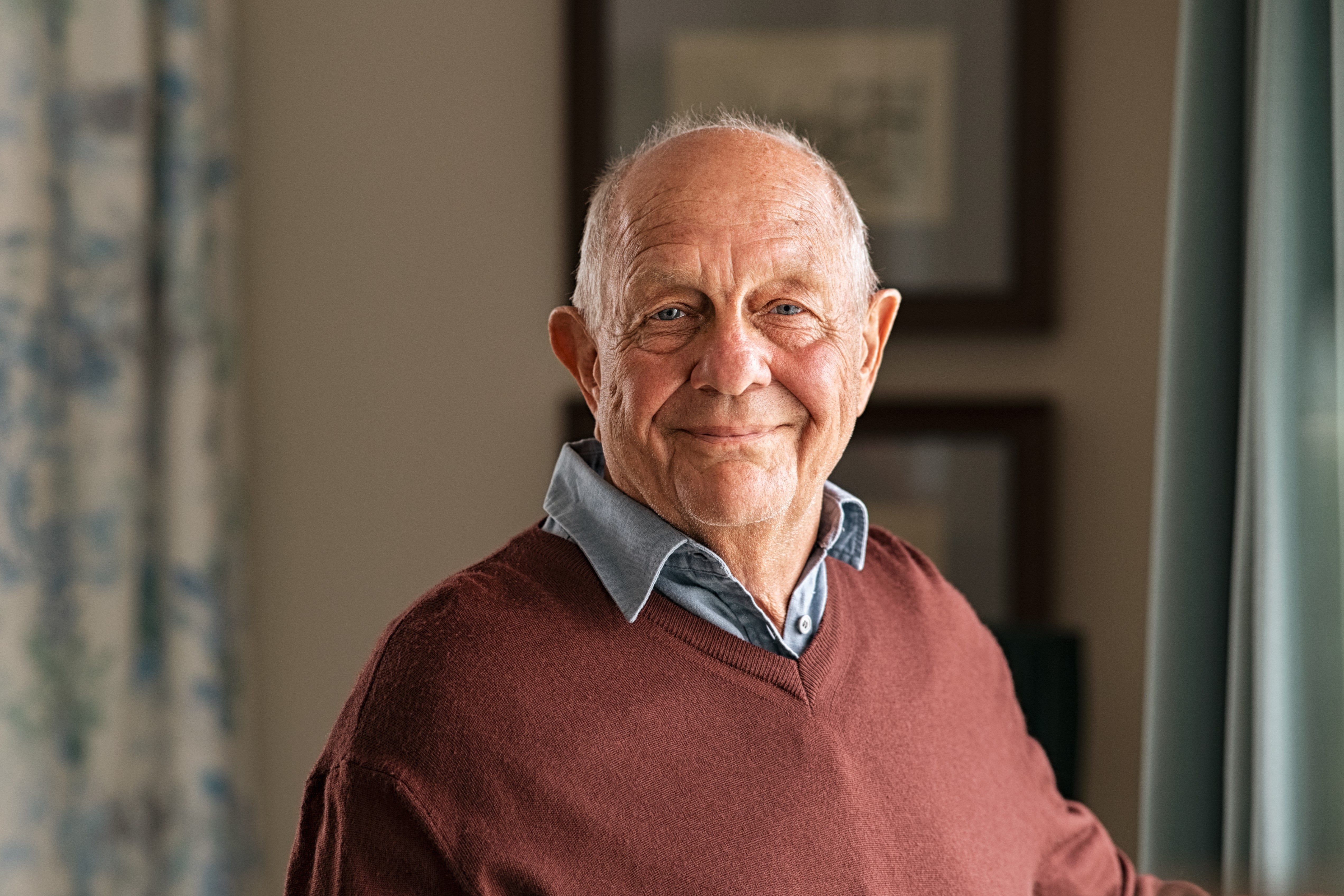 John smiling into the camera