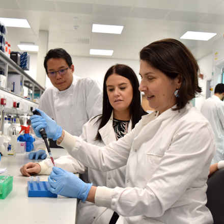 Dr Luminita Paraoan in the laboratory doing a demonstration 