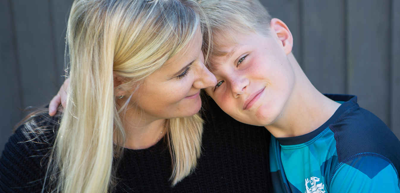 Sian posing closely with and smiling at her son Archie