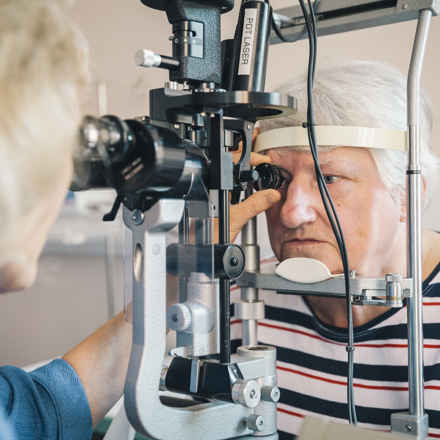 Elderly person having eye test