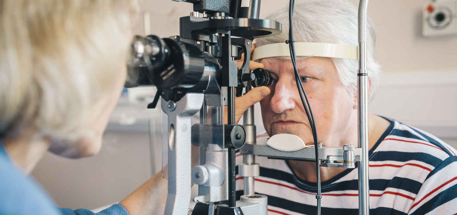 Elderly person having eye test