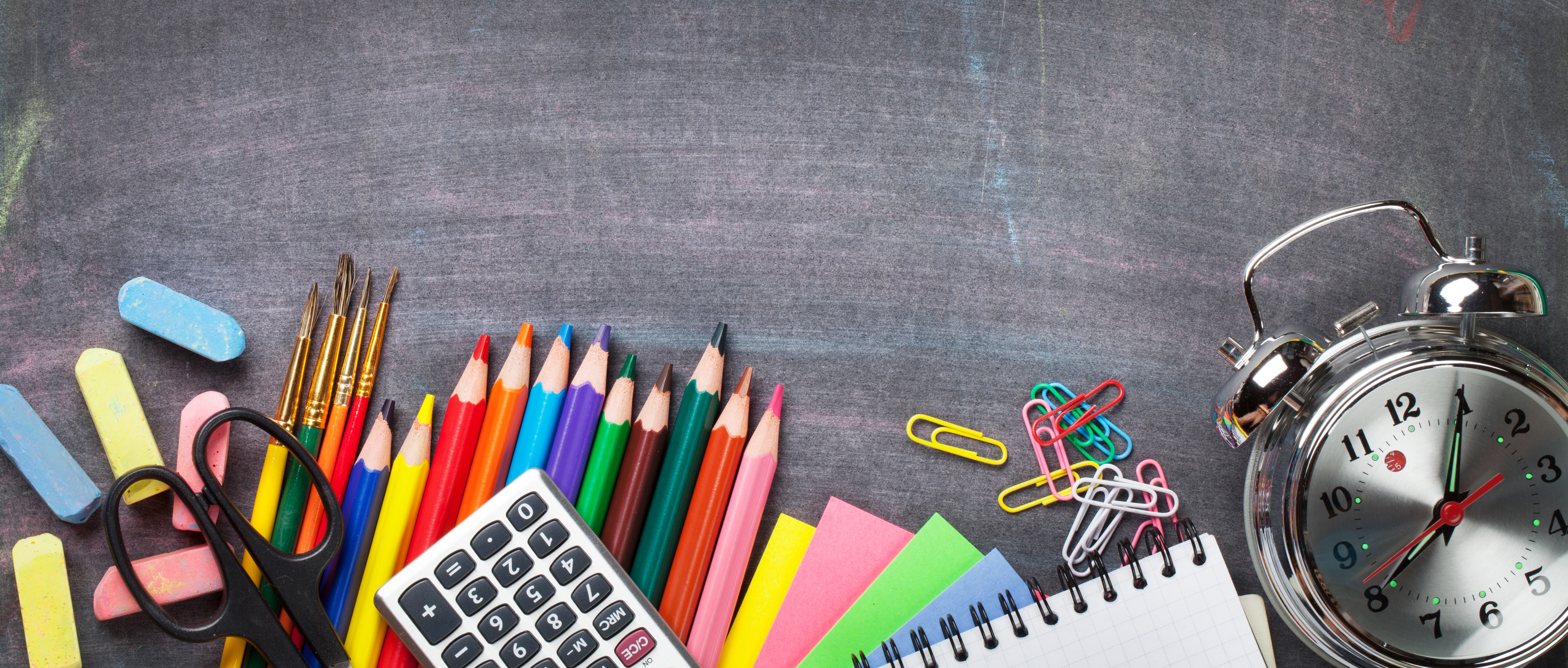 Teaching supplies including pencils, calculator and paper clips