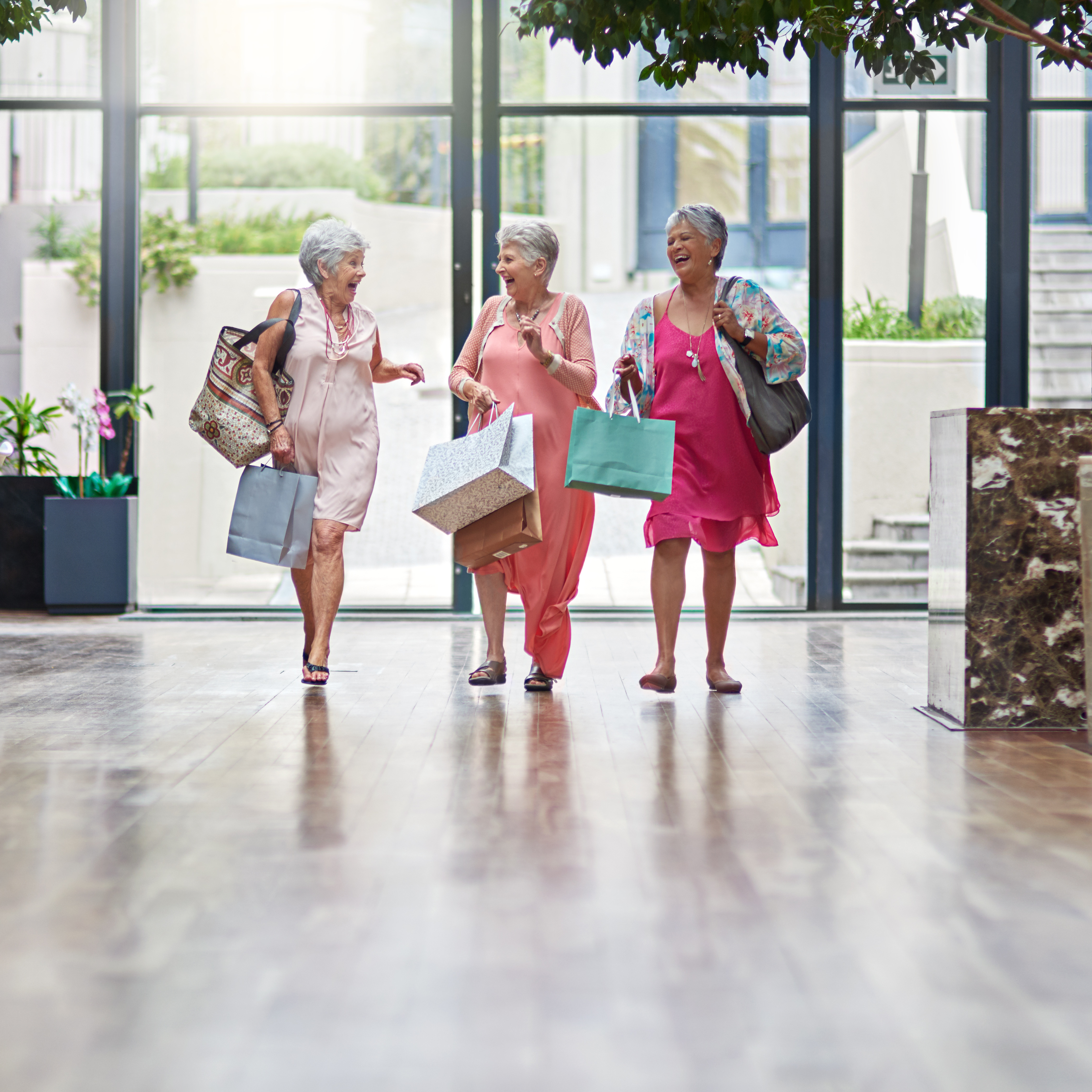 three women shopping and laughing